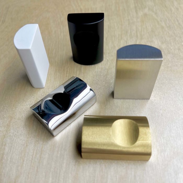 Five metal door pulls in the following finish types: matte black, satin white, satin brass, polished stainless and brushed stainless.